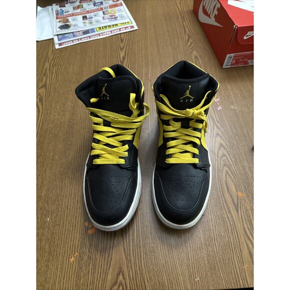 black and yellow jordan 10s